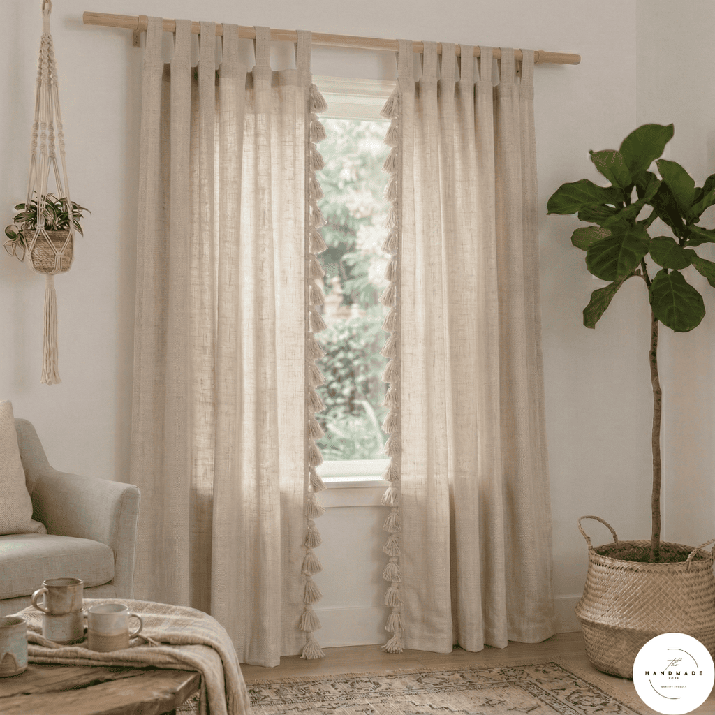 Pair of heavyweight hand-loomed Moroccan cotton curtains in oatmeal beige filtering natural light in a minimalist living room.