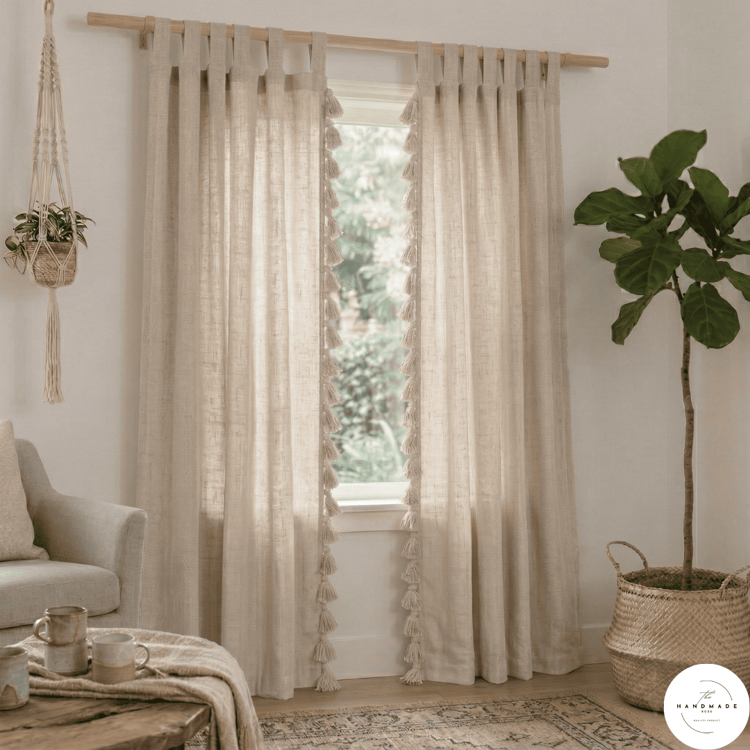 Pair of heavyweight hand-loomed Moroccan cotton curtains in oatmeal beige filtering natural light in a minimalist living room.