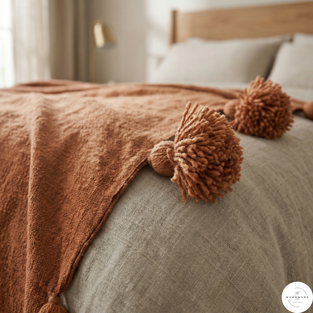 Moroccan throw blanket, hand-loomed cotton throw, oversized pom pom blanket, terracotta home decor, artisan made textiles, Marrakech weaving, heavy weight cotton blanket.