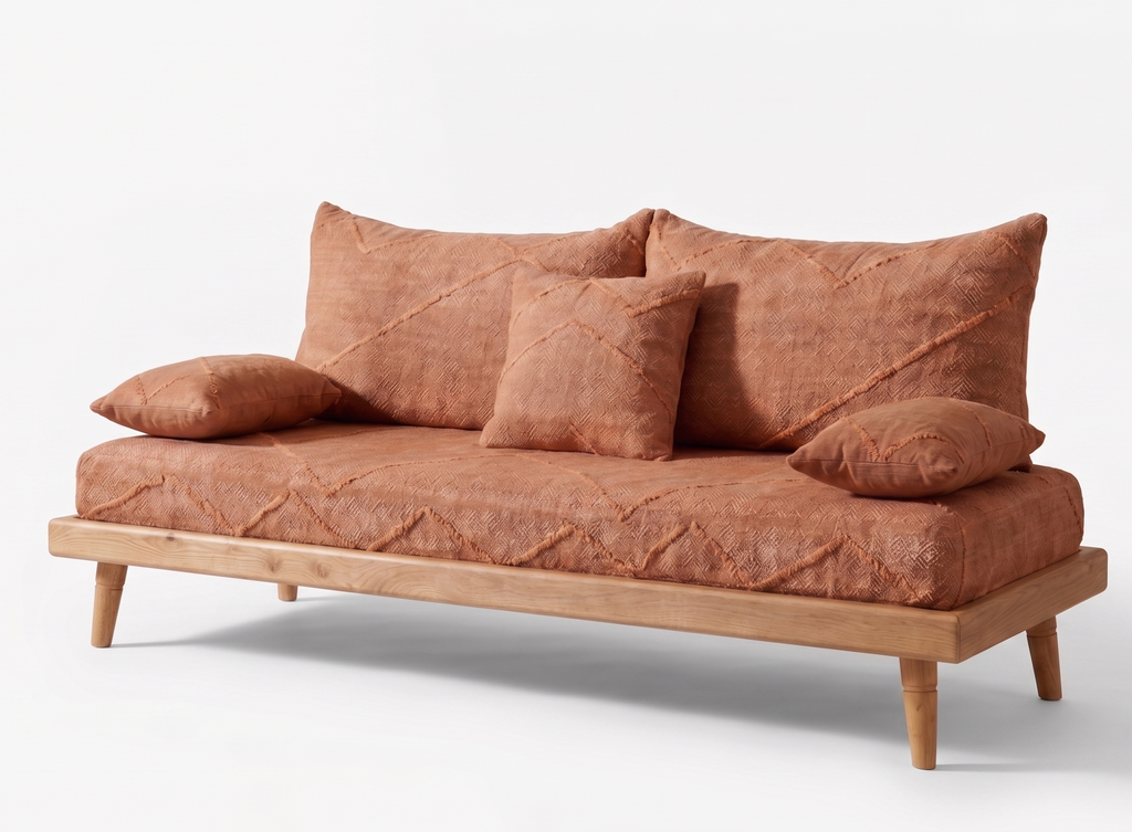 Handcrafted Moroccan low-profile sofa set with terracotta cotton cushions and natural wood frames in a warm, modern living room.